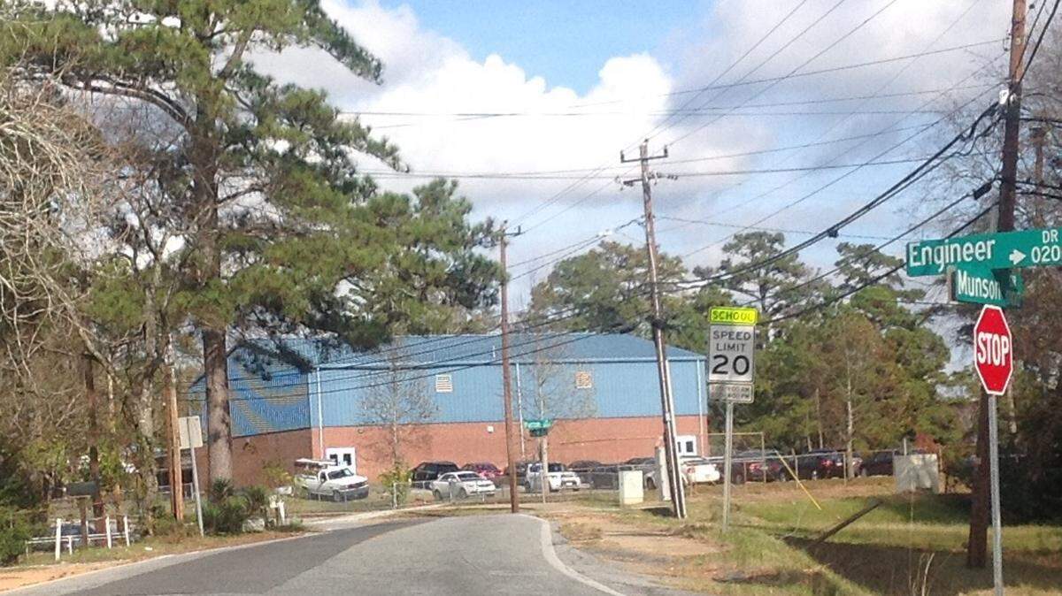 Mike Owen/mowen@ledger-enquirer.comA lone school zone warning sign tell drivers to slow down for the Benning Hills Head Start center. Other centers have no such signs.