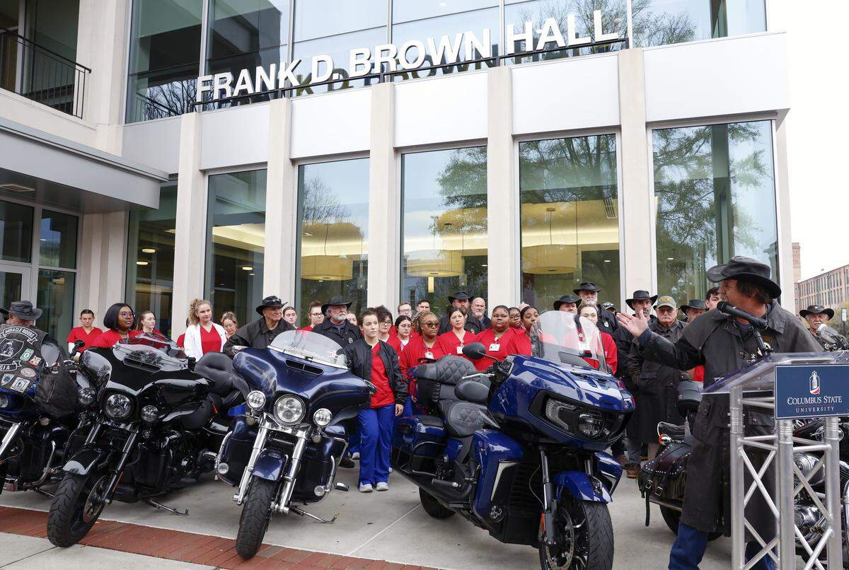The Miracle Riders have hit their $1 million fundraising goal for Columbus State University. Scott Ressmeyer, co-owner of Country’s Barbecue and founder of the Miracle Ride, far right at podium, made the announcement March 3, 2026, in front of CSU’s Frank D. Brown Hall in downtown Columbus.