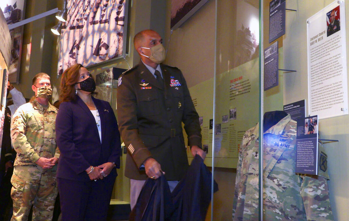 Lt. Gen. Gary Brito, right, former commanding general of the Maneuver Center of Excellence(MCOE) and Ft. Benning, unveils a new exhibit honoring him as his wife Michelle, center, and Maj. Gen. Patrick Donahoe, the current MCOE commanding general, watch. Brito was one of three soldiers honored Friday morning at the National Infantry Museum during the unveiling of a new diversity exhibit.