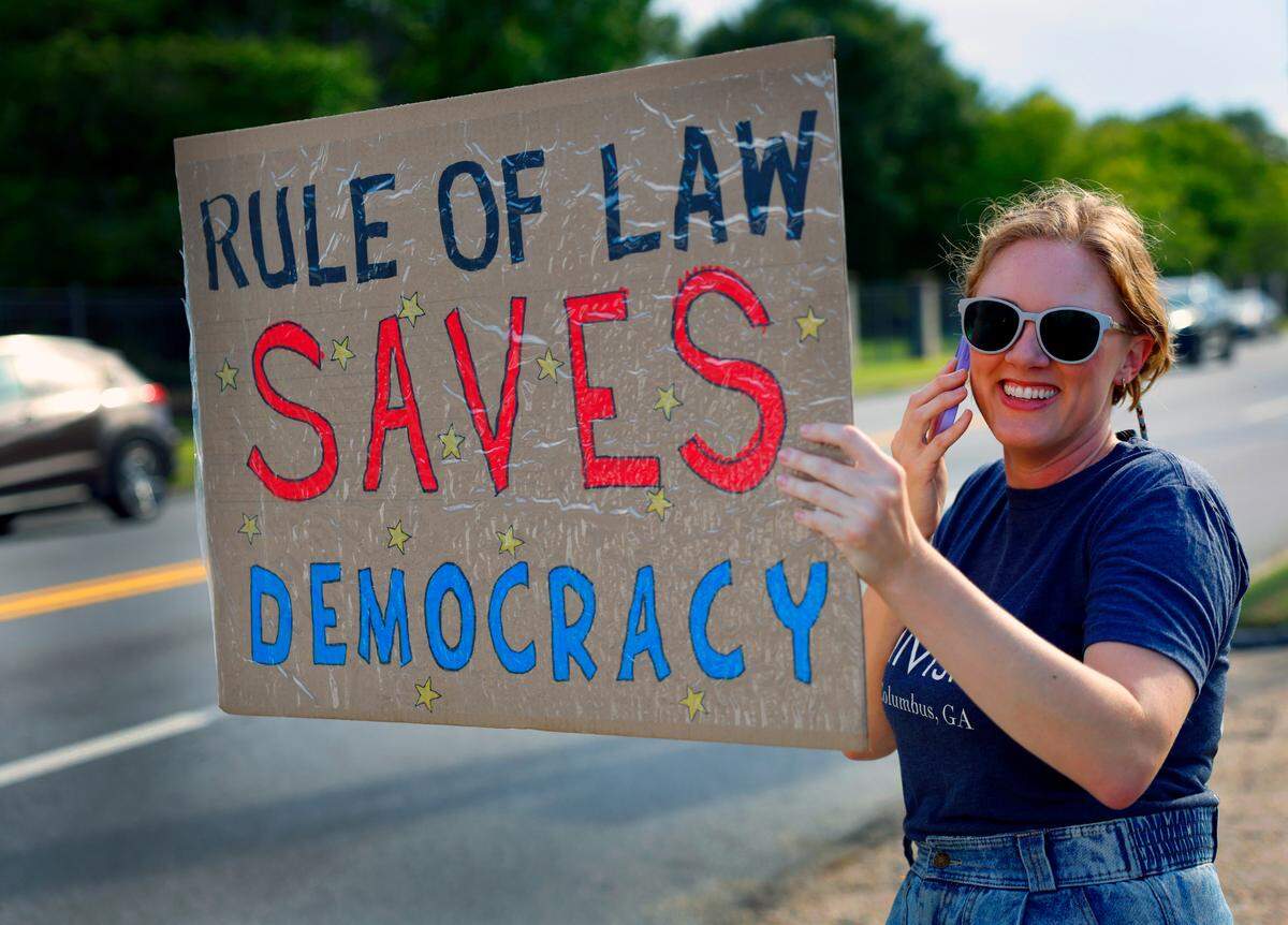 Laura Irvin, a member of the Columbus Indivisible leadership board, participates in the “Good Trouble Lives On” protest July 17, 2025, to honor the legacy of civil rights activist and politician John Lewis of Georgia, who died July 17, 2020. The event was organized by Columbus Indivisible.