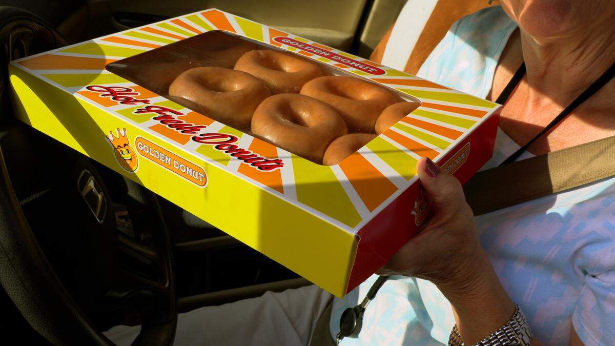 Golden Donut in Columbus celebrated National Donut Day Friday morning by giving away 400 boxes of donuts on a first come, first served basis. They were gone in a little over an hour. They popular donut shop is expected to reopen in mid to late July.