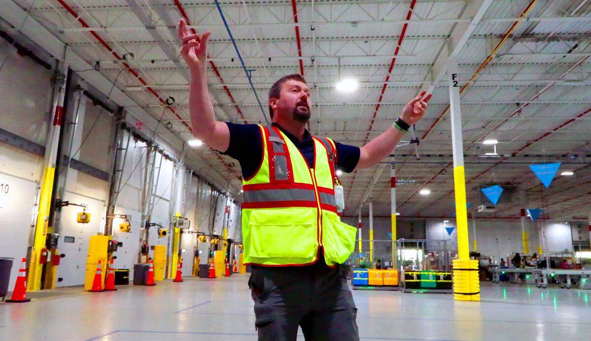 David Briceland, site lead at Amazon’s delivery station in Columbus gives a tour of the facility April 10, 2025