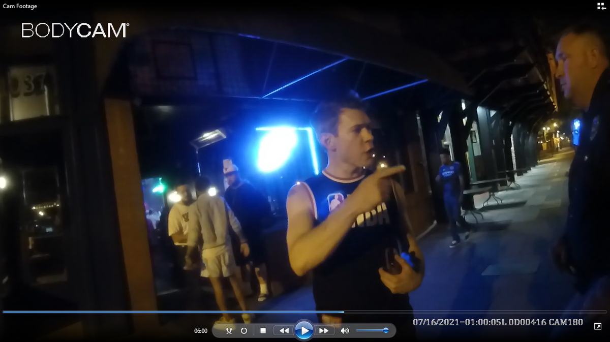 Body camera footage captured by an off-duty Columbus police officer outside of The Hooch bar shows suspended District Attorney Mark Jones arguing about a homicide case with CPD Cpl. Sherman Hayes.