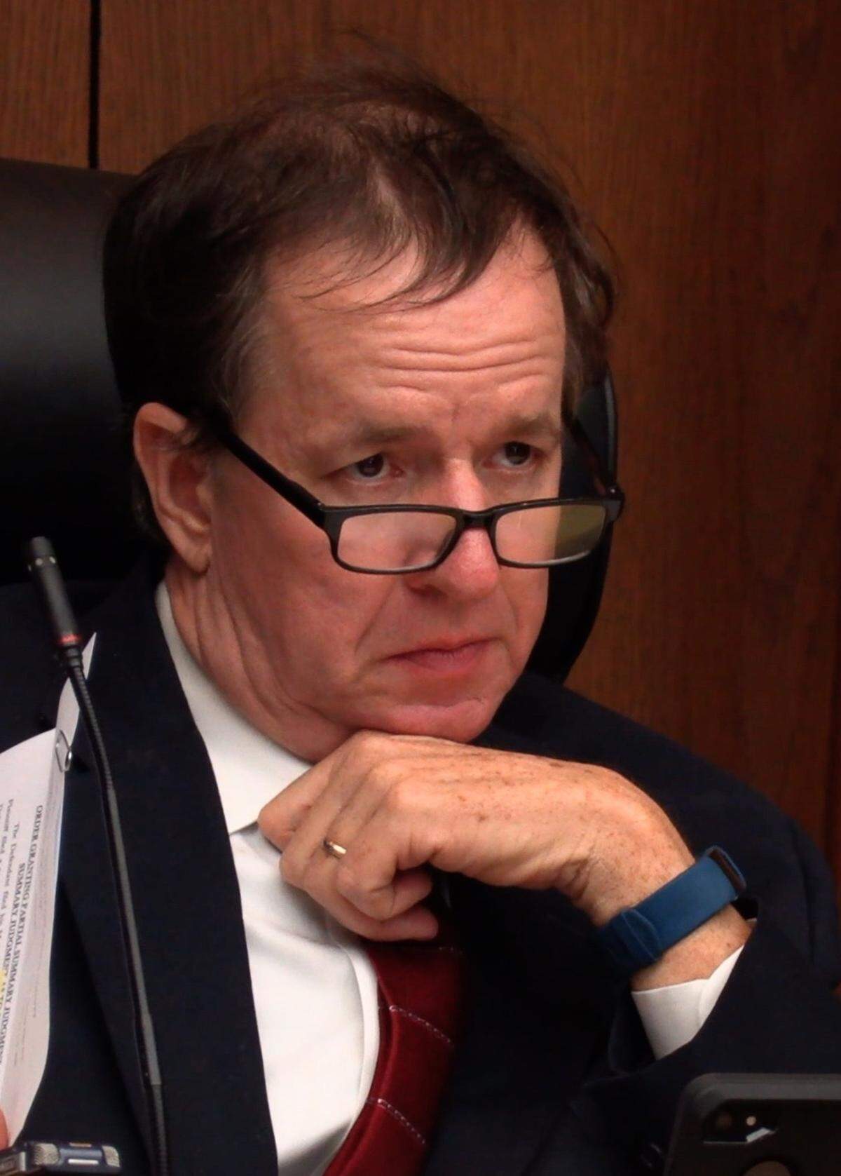 Superior Court Judge Gil McBride listens Monday afternoon. to an attorney representing Rebecca Haynie during a hearing for Haynie and Keith “Bull” Phillips. Haynie and Phillips are charged with murder in the 2004 homicide of Haynie’s then-husband Kirby Smith inside Kirby’s Speed Shop, 1438 Jacqueline Drive, in Columbus.
