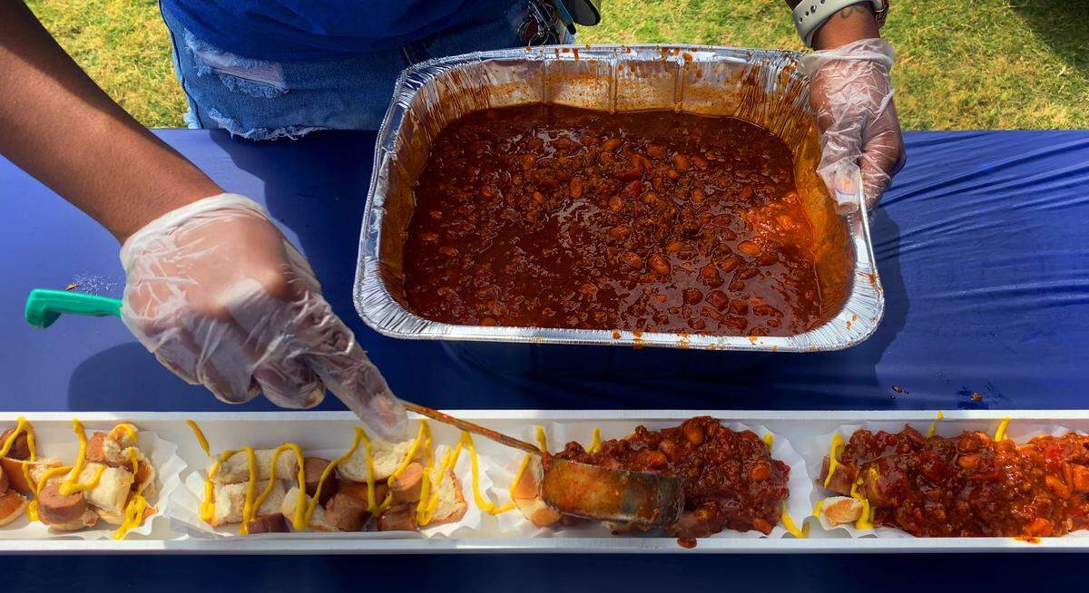 Columbus State University’s Archives & Special Collections arranged for the creation and serving of a 50-foot-long scrambled dog made by Country’s BBQ to students and employees on Thursday afternoon at the foot of the clock tower on CSU’s main campus. 05/01/2025