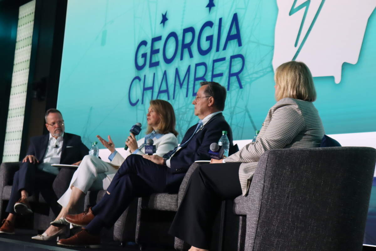 Kim Greene, President and CEO Georgia Power (second from left), speaks to the State of Energy conference audience at the Coca-Cola headquarters in Atlanta, Ga., on May 28, 2026, about energy reliability amid unprecedented data center growth.