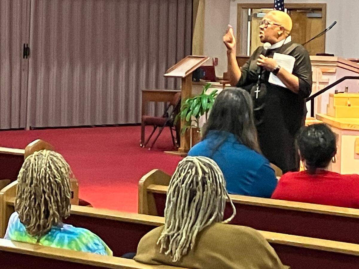 Andrea Johnson, associate pastor Kingdom Power Community Church in Columbus, speaks during a gathering of supporters for fired Central High School girls basketball coach Carolyn Wright on Aug. 8, 2023, at Franchise Missionary Baptist Church in Phenix City.