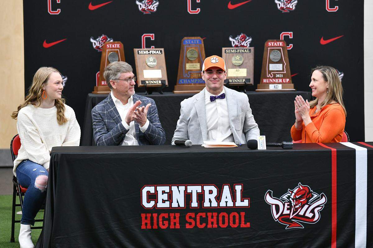 Central High School student Caleb Nix is joined by his family during a national signing day ceremony Wednesday morning at Central High School in Phenix City, Alabama. Nix has committed to Clemson University.