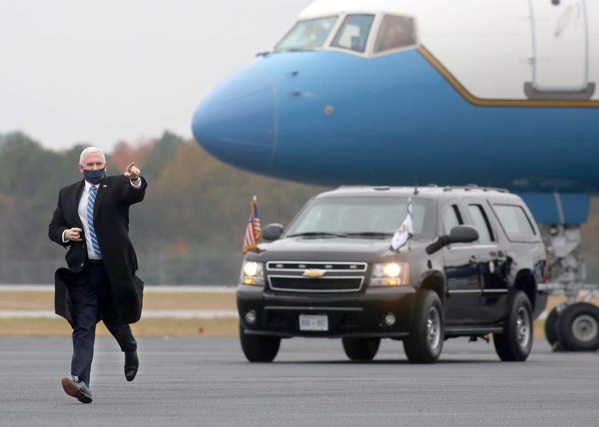 Vice President Mike Pence arrives to campaign for the re-election of Senators David Perdue and Kelly Loeffler on Thursday, Dec. 17, 2020 at the Columbus Airport.