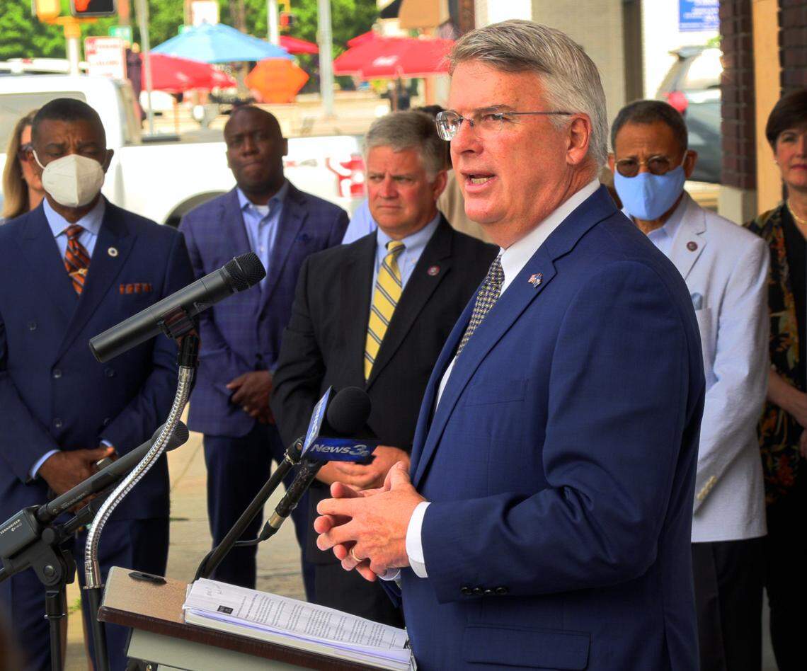Columbus Mayor Skip Henderson, center, speaks during a Thursday morning press conference in downtown Columbus, Georgia where official announced the sale of the Ralston Towers. 06/03/2021