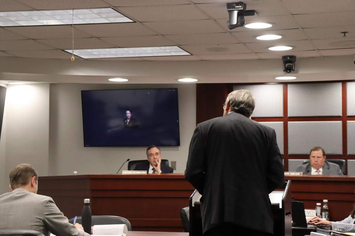Robert Baker, lawyer for MARTA and a former Georgia Public Service Commissioner, questions a Georgia Power official during cross-examination. Commissioners Peter Hubbard, left, and Jason Shaw, right, listen during FCR-27 hearings May 5, 2026.