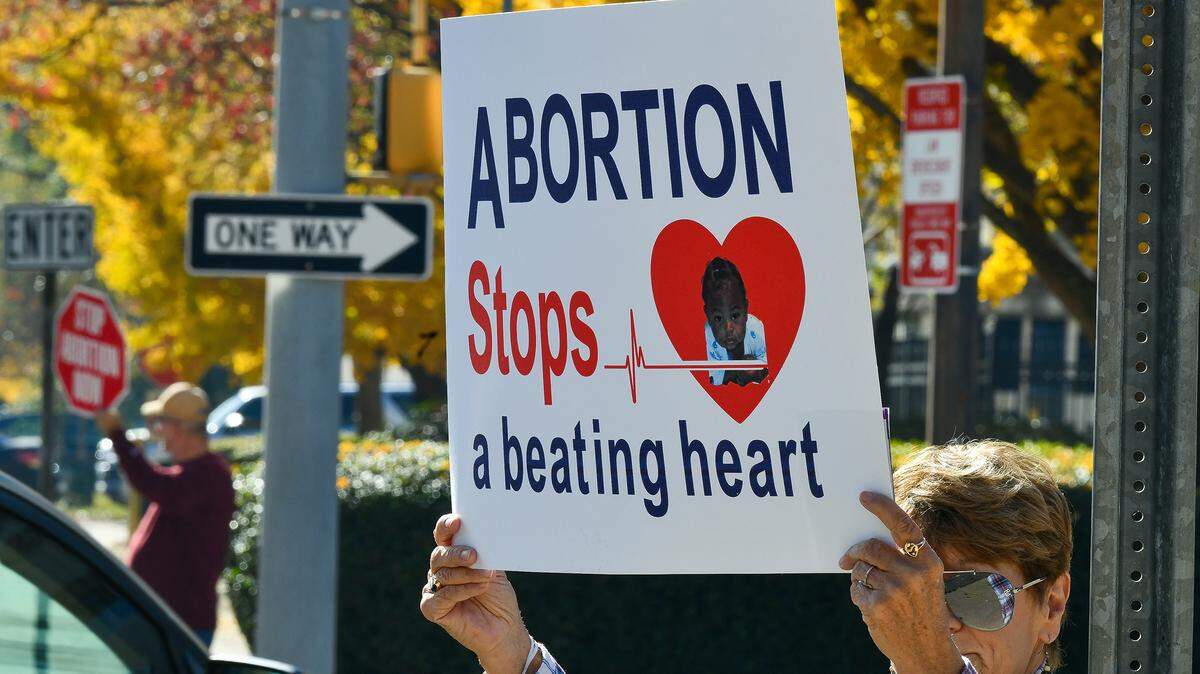 Members of Chattahoochee Valley United for Life, the Knights of Columbus, and East Alabama Right to Life hold a protest against abortion outside the federal court House on 12th Street Wednesday afternoon, the same day the United States Supreme Courts heard oral arguments in a case involving Mississippi’s law banning abortions after 15 weeks. 12/01/2021