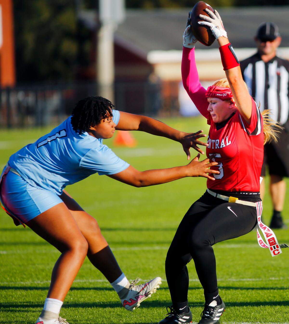 Central High School’s Ally Supan, right, tries to avoid a Brewbaker tech defender Monday afternoon during Central’s varsity flag football game at Garrett-Harrison Stadium in Phenix City, Alabama. 10/14/2024