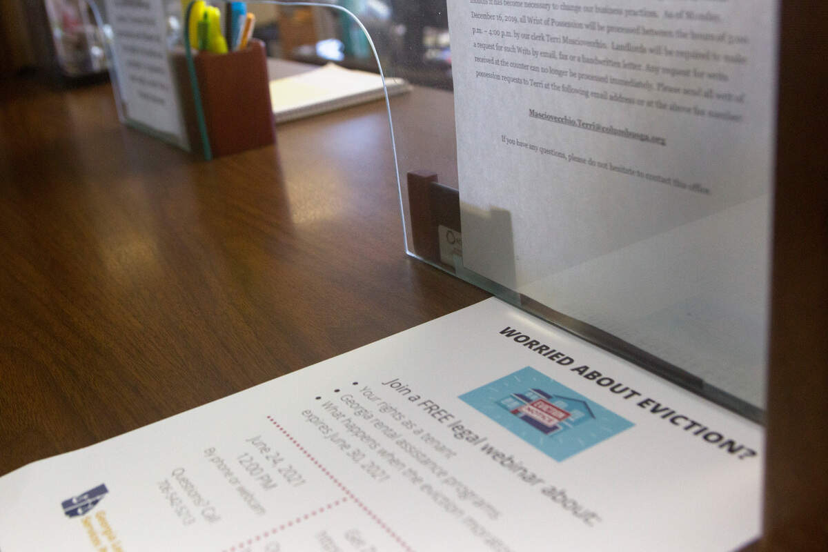 A flyer from the Georgia Legal Services Program offers resources to those facing eviction at the Magistrate Court in the Government Center on July 13, 2021, in Columbus, Ga. Court clerks cannot tell visitors about the CDC’s eviction moratorium but can provide advertising from nonprofits that can help.