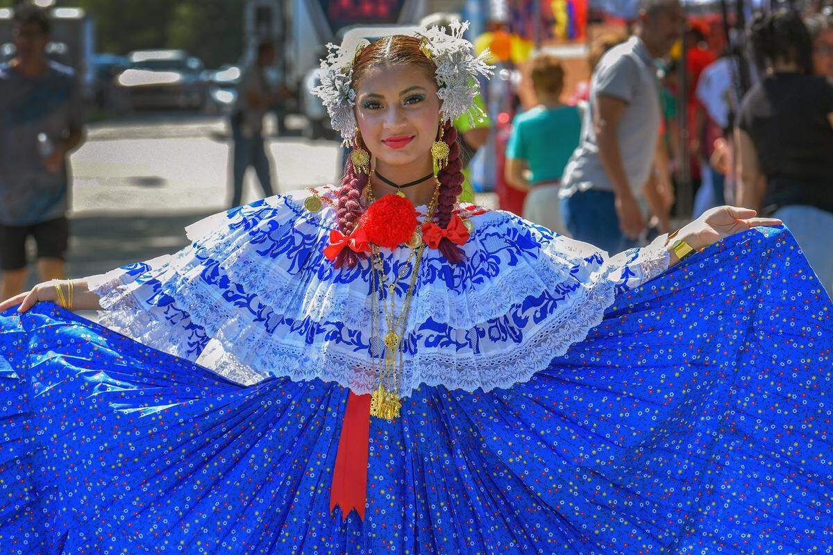 Genesis Garcia models a Panamanian-style dress Saturday at the Tri-City Latino Festival in Columbus, Georgia. 09/21/2024