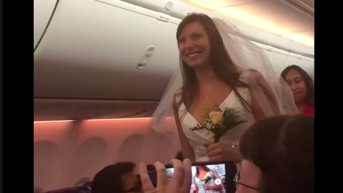 A couple exchanged wedding vows then danced down the isle of a Southwest Airlines flight to Las Vegas. Video of the in-flight wedding was captured by a passenger and posted to Facebook. The pilot officiated.