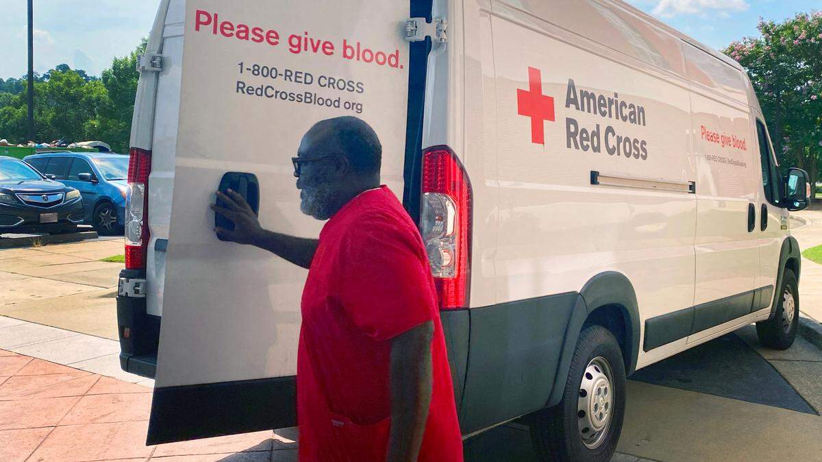 American Red Cross workers prepare to leave the Columbus Public Library after a blood drive scheduled for July 9, 2025, was postponed.
