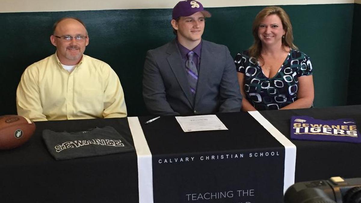 Calvary Christian senior Andrew Fowler signs with Sewanee University in a ceremony at Calvary on Monday, May 1, 2017.