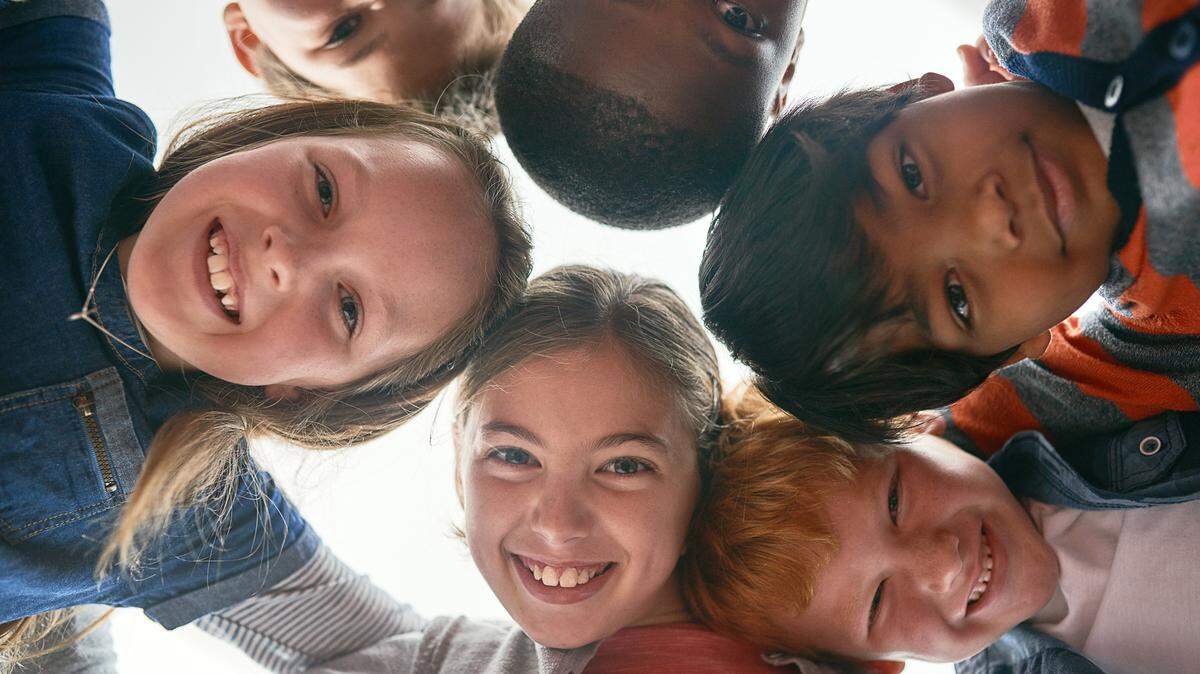 Cropped shot of elementary school children in class