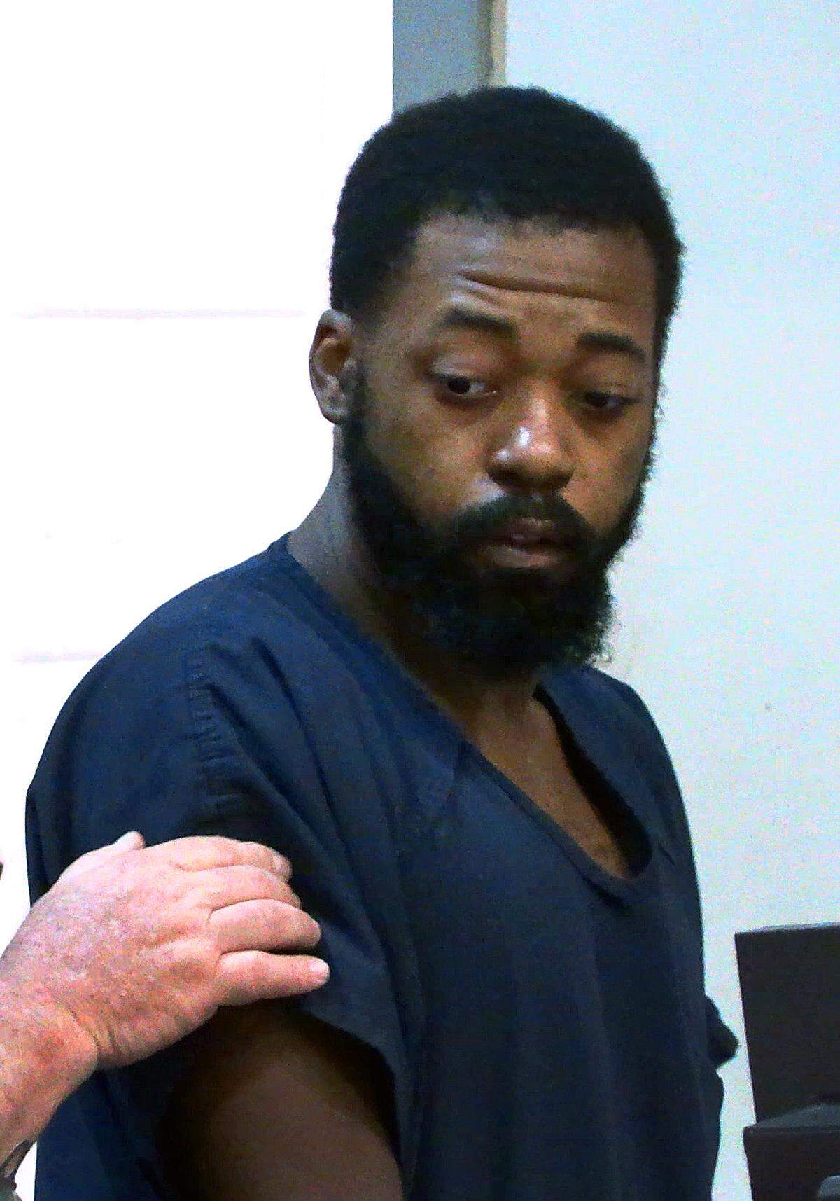 Gregory Wharton Jr., 26, is escorted from Columbus Recorder’s Court in Columbus, Georgia after his hearing Friday morning.. Wharton is charged with murder in the Monday death of 77-year-old Lystra Lewis on Wedel Drive, off Double Churches Road in the Kirkwood subdivision of north Columbus. 07/28/2023