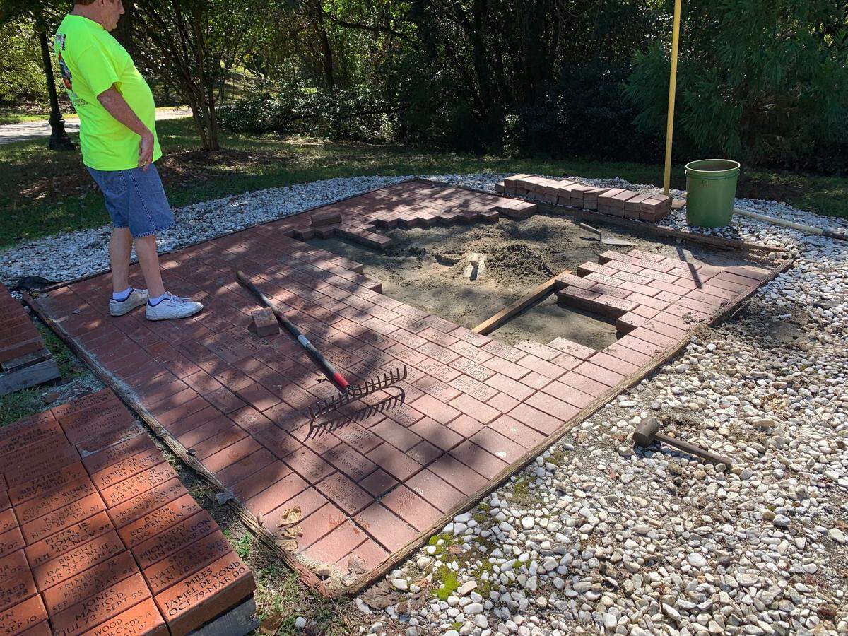 Family members of homicide victims came together Friday, Oct. 14 to help restore the Homicide Victims Memorial.