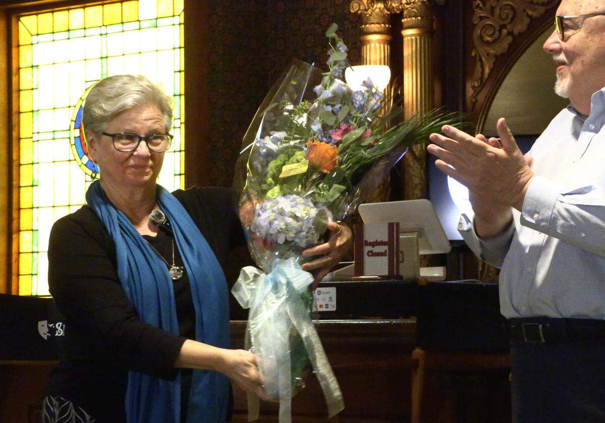 Debbie Anderson receives flowers at the “Springer Unplugged” event on Friday, April 26, 2024 after it was announced she is retiring as the Springer’s musical director. 04/26/2024