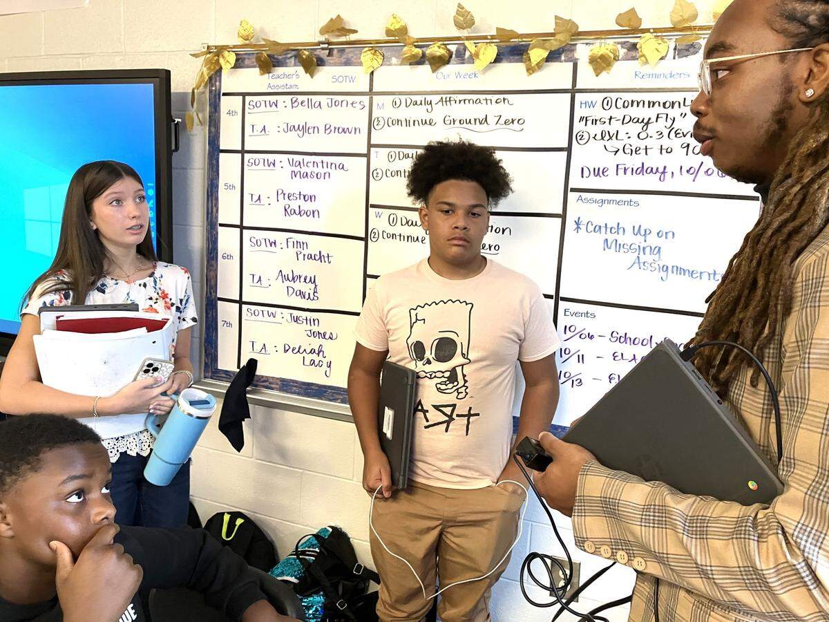 Harris County Carver Middle School English language arts teacher Jalin Murphy talks with students after one of his classes Oct. 5, 2023. Murphy is the Harris County School District 2023 Teacher of the Year.