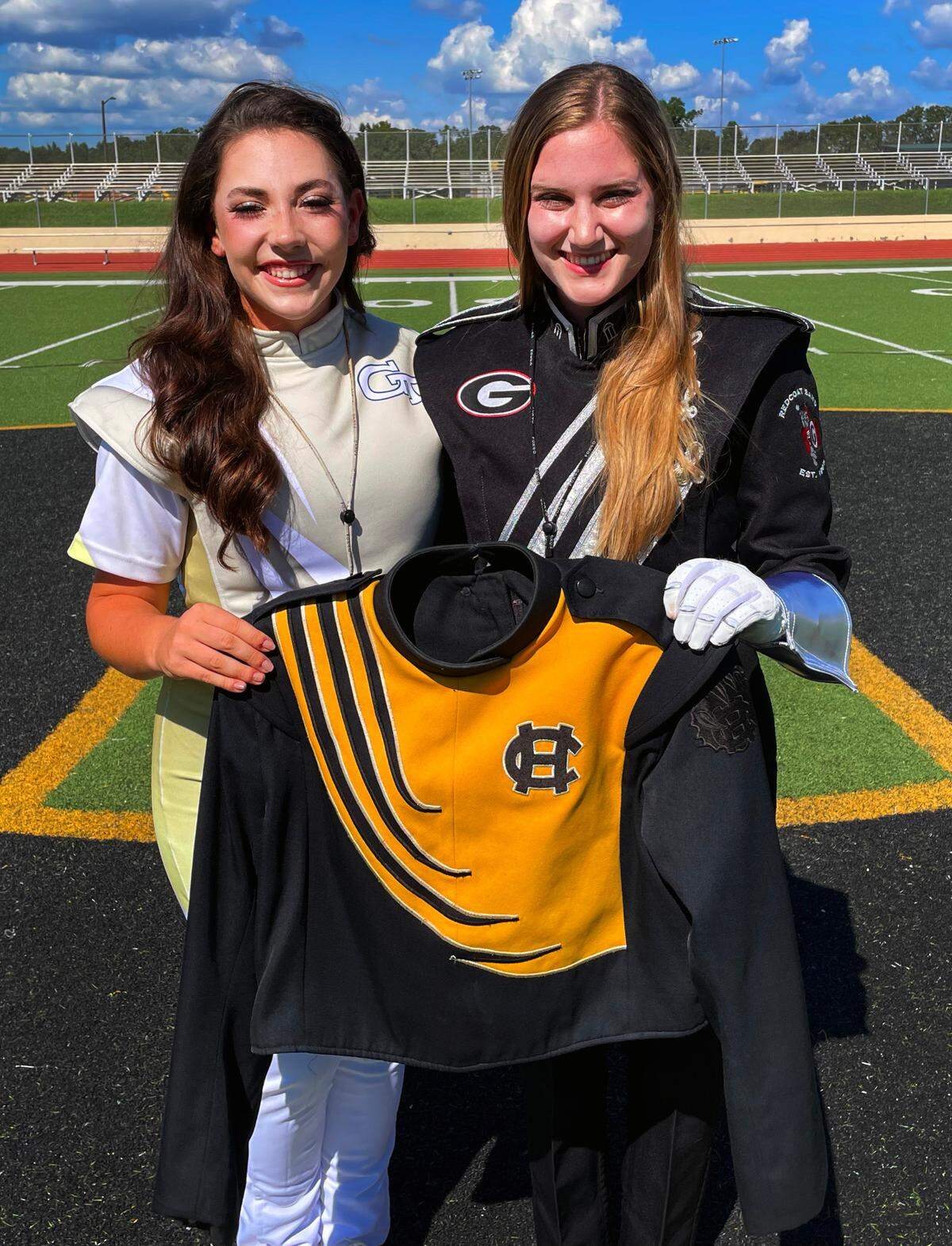 Georgia Tech drum major Kaleigh Griswell, left, and University of Georgia drum major Hannah Marston are Harris County High School graduates. They returned to HCHS for a photo session Aug. 28, 2022. They credit HCHS with helping them succeed.