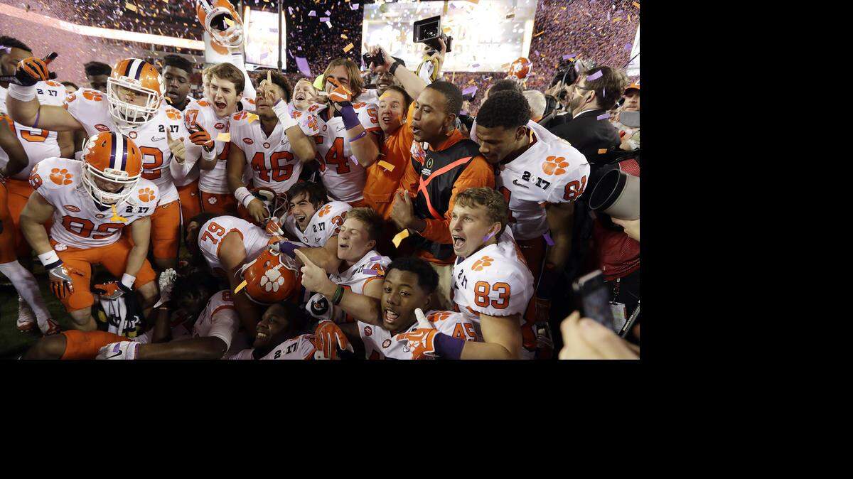 Clemson players celebrate after defeating Alabama, 35-31, in the College Football Playoff national championship game.
