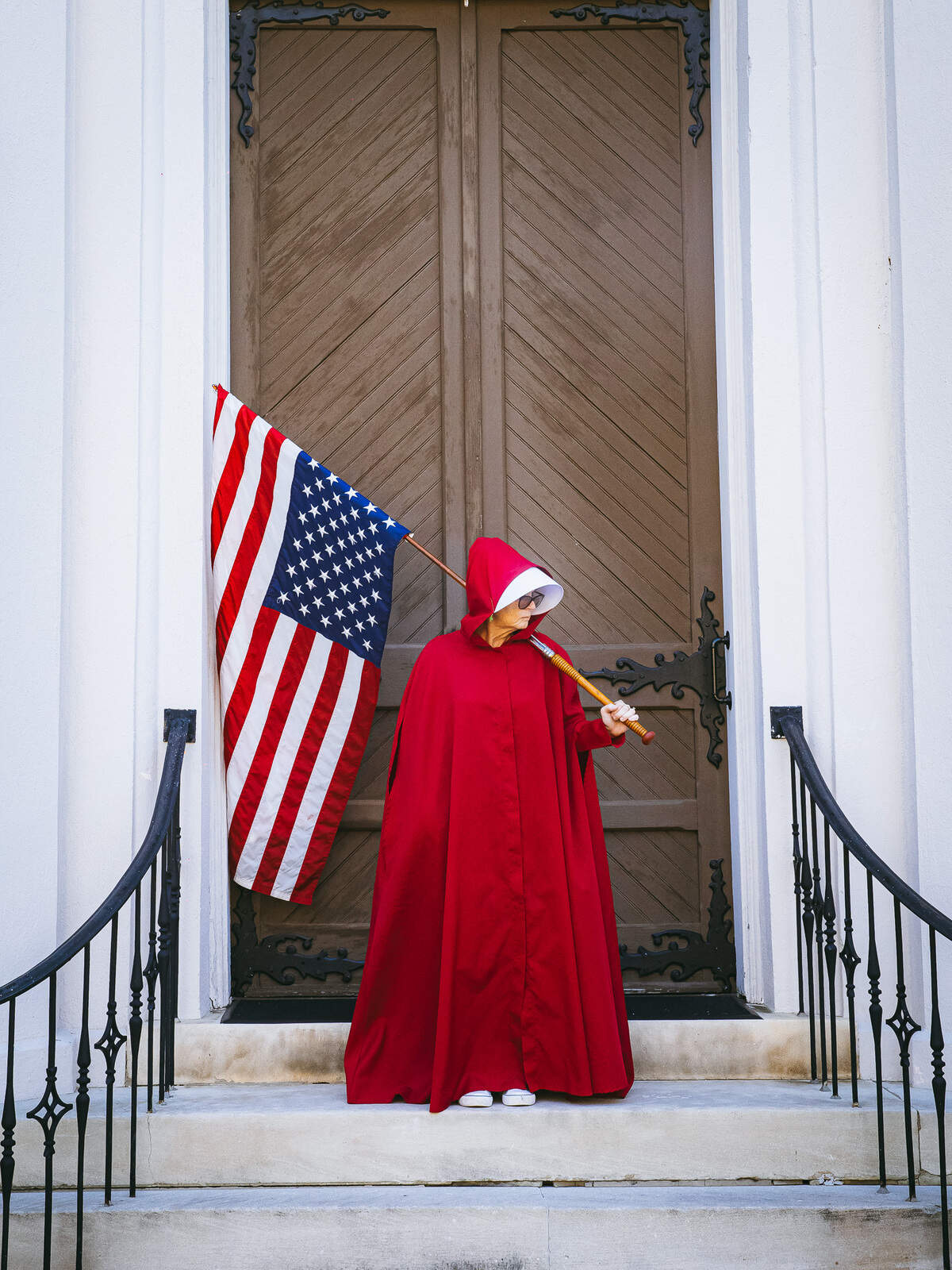 Cindy Richards uses the red cloak and white hood from The Handmaid’s Tale as a protest for the erosion of women’s rights.