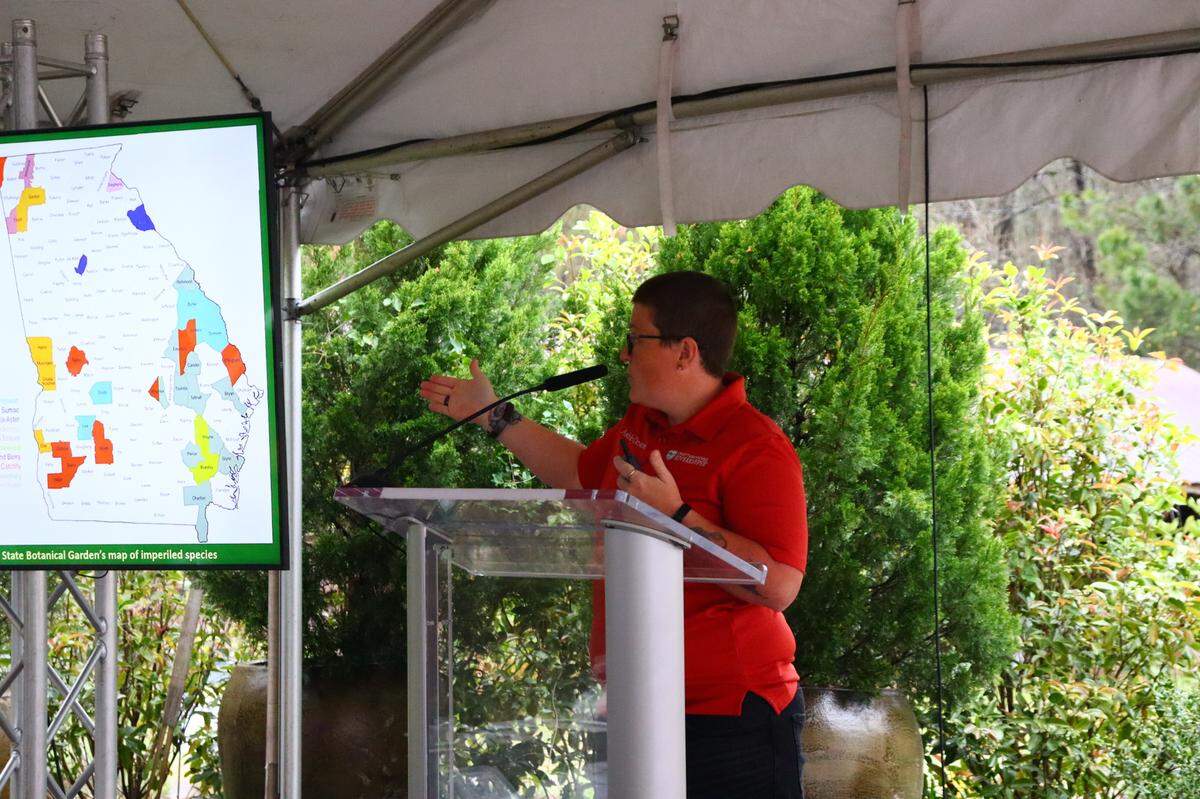 Ashley Desensi, biology professor at CSU and founder of Native Plant Coalition shows counties in Georgia that are host to endemic (only found there) native plants to a group of naturalist at the 2024 Naturalist Symposium. 3/16/24