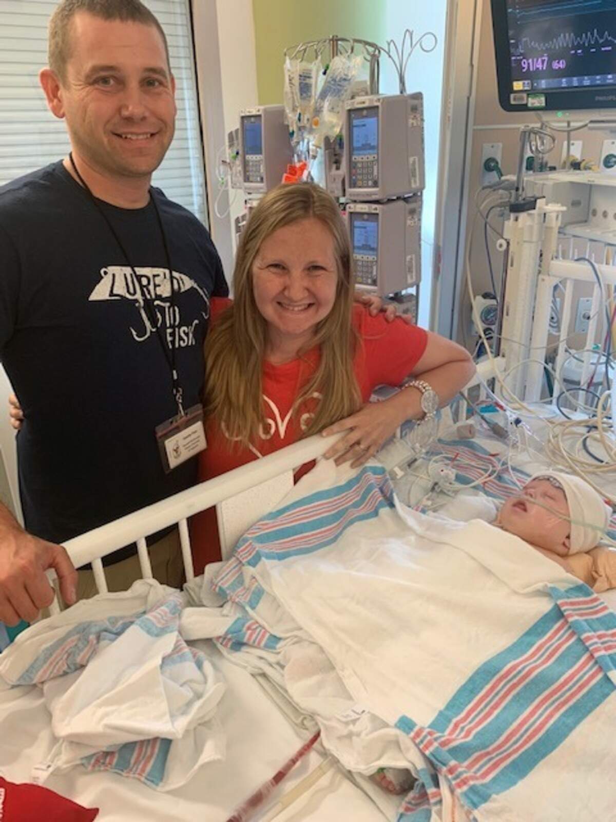 The Nobleses with Gracie in the hospital.