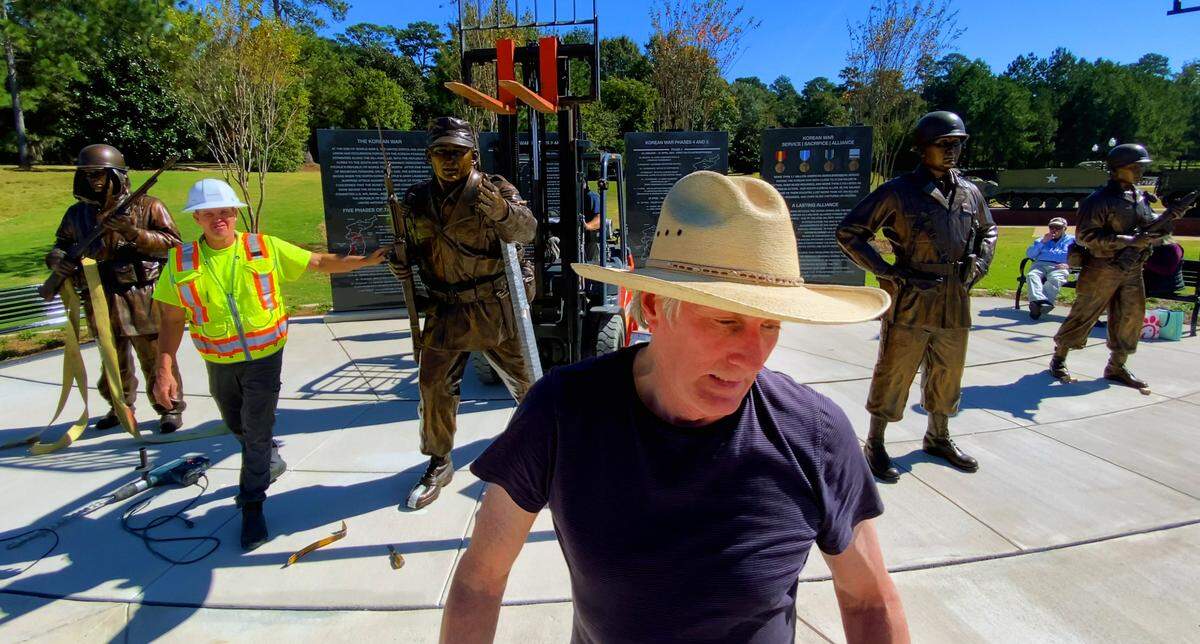 Sculptor Jay Warren, front, created four larger-than-life sculptures, including one of Col. Ralph Puckett Jr., for installation at the Korean War Memorial at the National Infantry Museum. 10/21/2024
