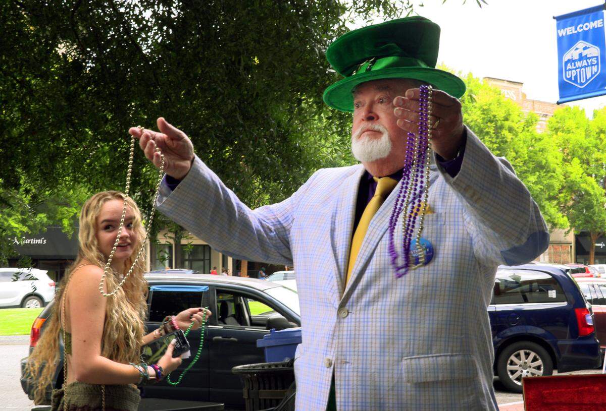 Steve Scott, the late founder and organizer of the Strut the Hooch parade in Columbus, is pictured in 2021 promoting the event during a Market Days on Broadway in downtown Columbus.