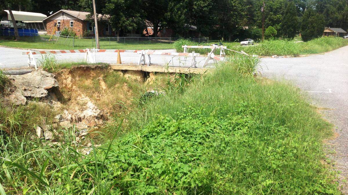 Mike Owen/mowen@ledger-enquirer.comShown above is the erosion eating away at the earthen bridge on Grady Drive, which runs off of Miller Road near Waddell Elementary School. A Concerned Reader first reported this in 2012 -- no work has been completed yet.
