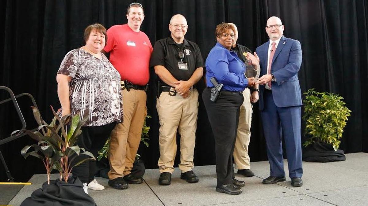 From left to right, Columbus State University Police Department representatives, Administrative Coordinator Debby Mayo ; Lieutenant Brett Stanelle; Sergeant James Geeslin; Lieutenant Tess Taylor and Lieutenant Ben Scott, accept the university’s inaugural “Living Our Values Award” presented by CSU President Chris Markwood at a welcome back kickoff event on Monday, Aug. 8.