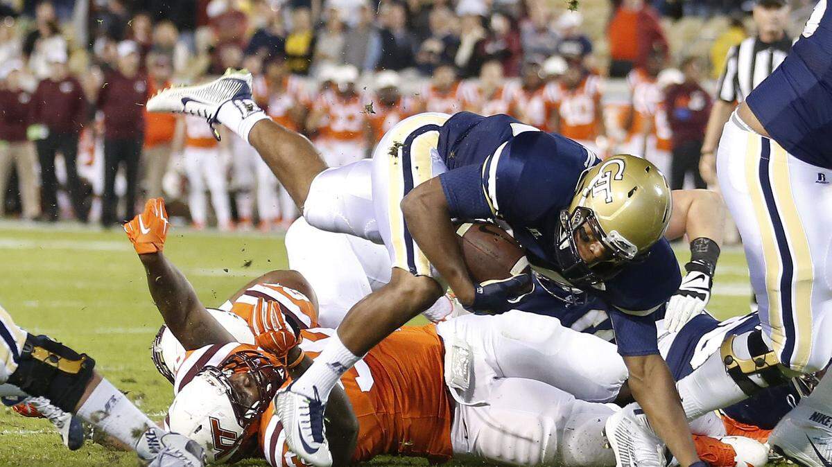 Georgia Tech running back Marcus Allen gets past Virginia Tech defensive tackle Luther Maddy (92) to score a touchdown during the first half of an NCAA college football game Thursday, Nov. 12, 2015, in Atlanta. (AP Photo/John Bazemore)