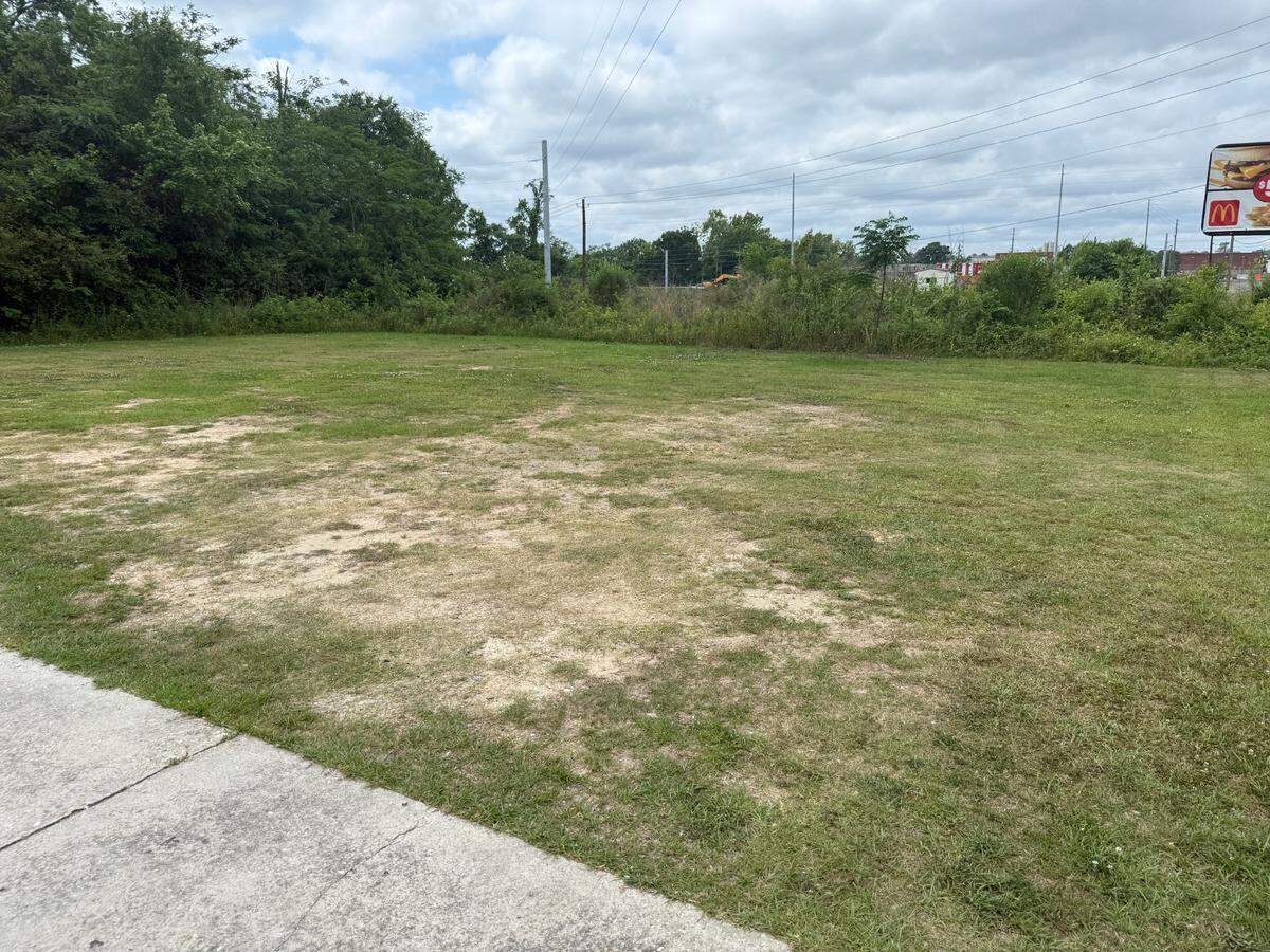 Ronald Carthar, owner of Morris Rd. Hotdogs & BBQ in Columbus, says many passing cars use his parking lot to make U-turns, causing an erosion of his lawn.