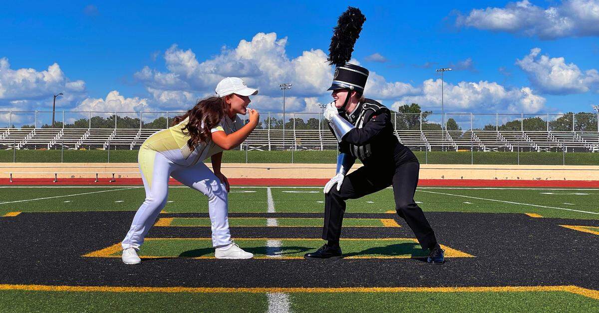 Georgia Tech drum major Kaleigh Griswell, left, and University of Georgia drum major Hannah Marston are Harris County High School graduates. They returned to HCHS for a photo session Aug. 28, 2022, celebrating their success. They will watch each other perform during halftime of this year’s UGA-Tech rivalry game.