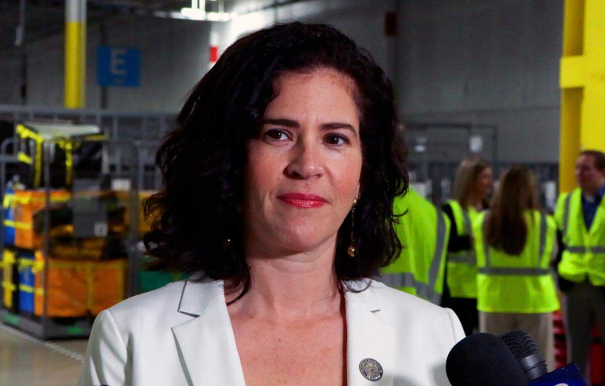 Bárbara Rivera Holmes, commissioner of the Georgia Department of Labor, answers questions from the media after a ribbon-cutting ceremony at Amazon’s delivery station in Columbus on April 10, 2025.
