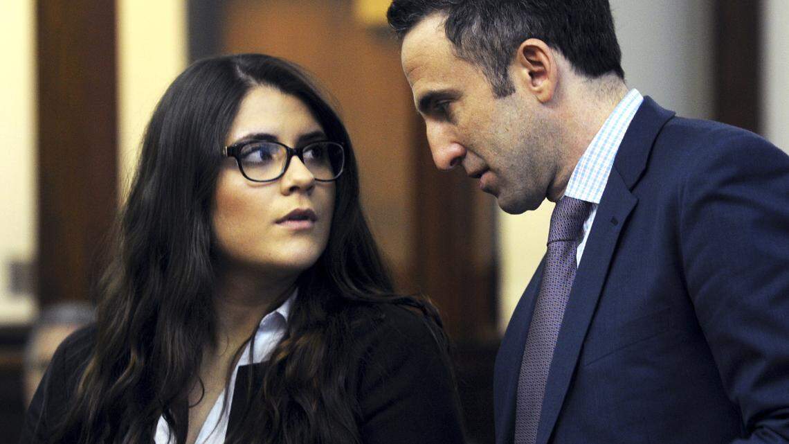 In this March 3, 2017 photo, Nikki Yovino, left, appears with her attorney Mark Sherman as she is arraigned in Bridgeport Superior Court, in Bridgeport, Conn.