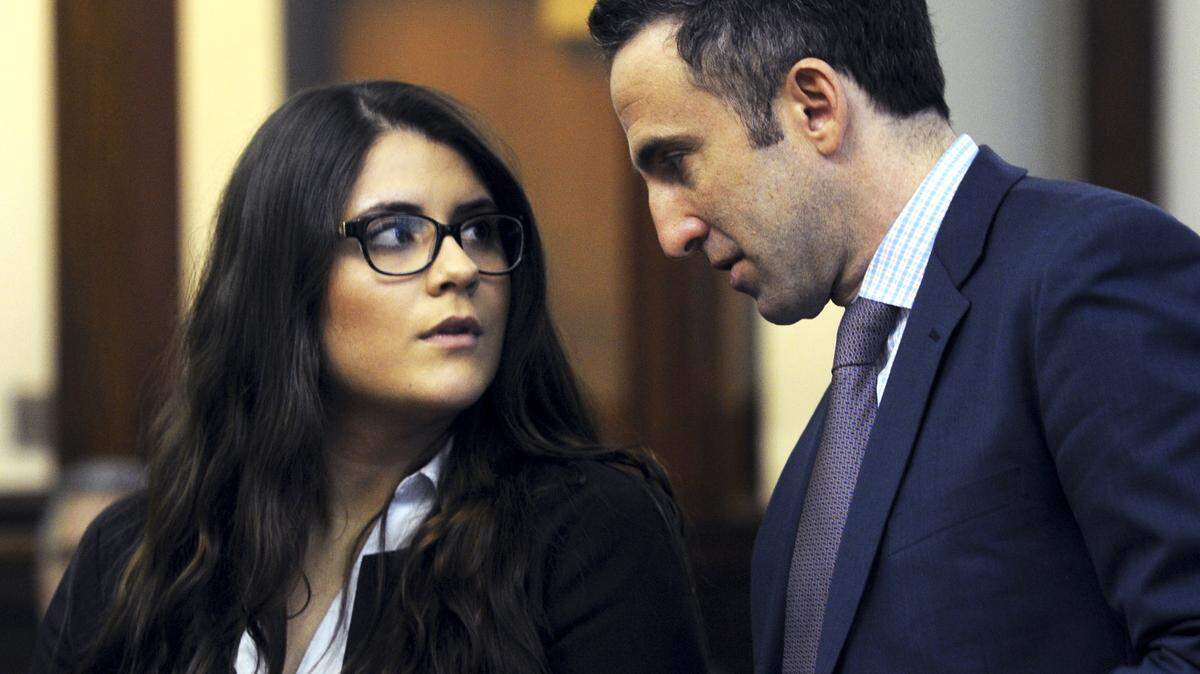 In this March 3, 2017 photo, Nikki Yovino, left, appears with her attorney Mark Sherman as she is arraigned in Bridgeport Superior Court, in Bridgeport, Conn.