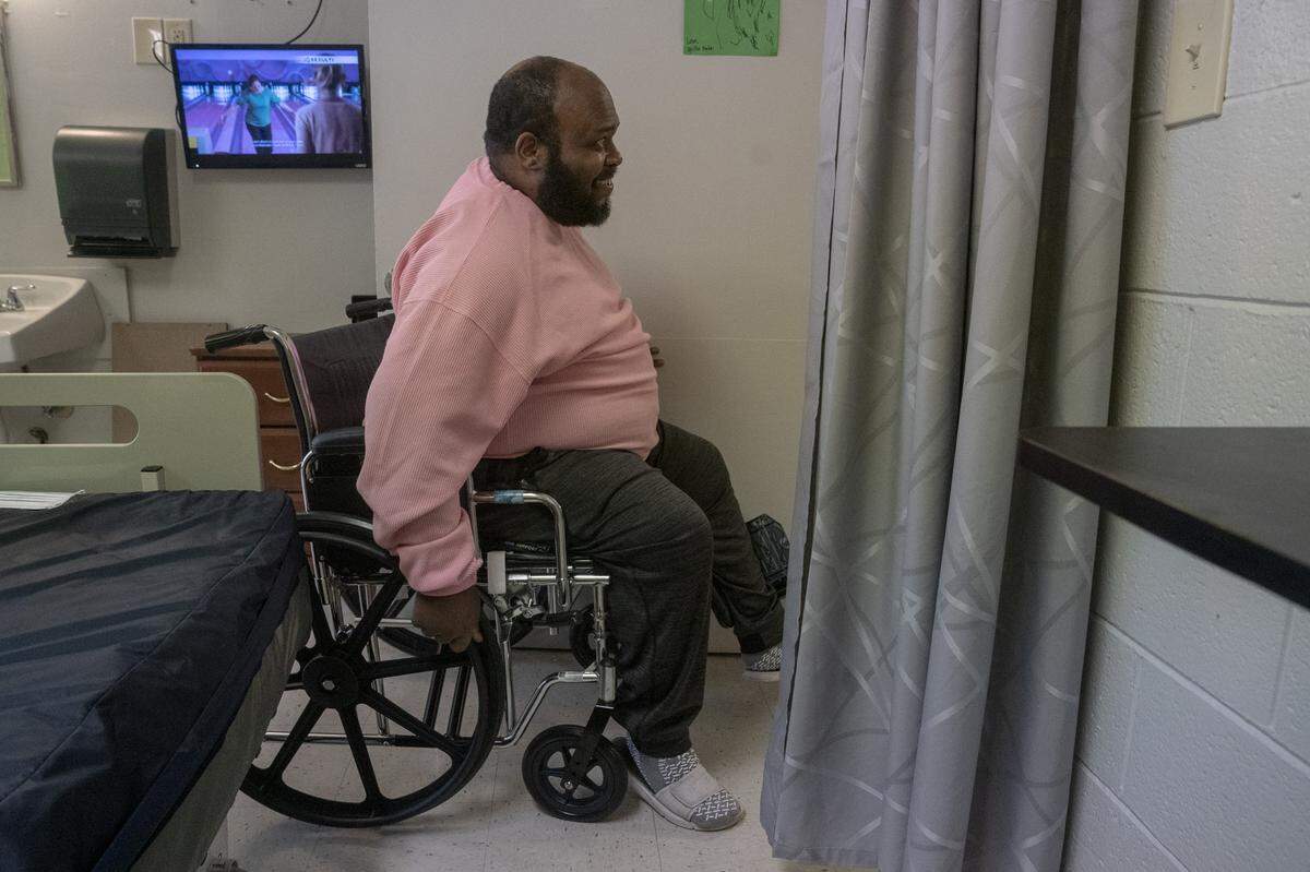 For the last time, Eric Lofton leaves his room at River Towne Center nursing facility, on May 27, 2021, in Columbus, Ga.