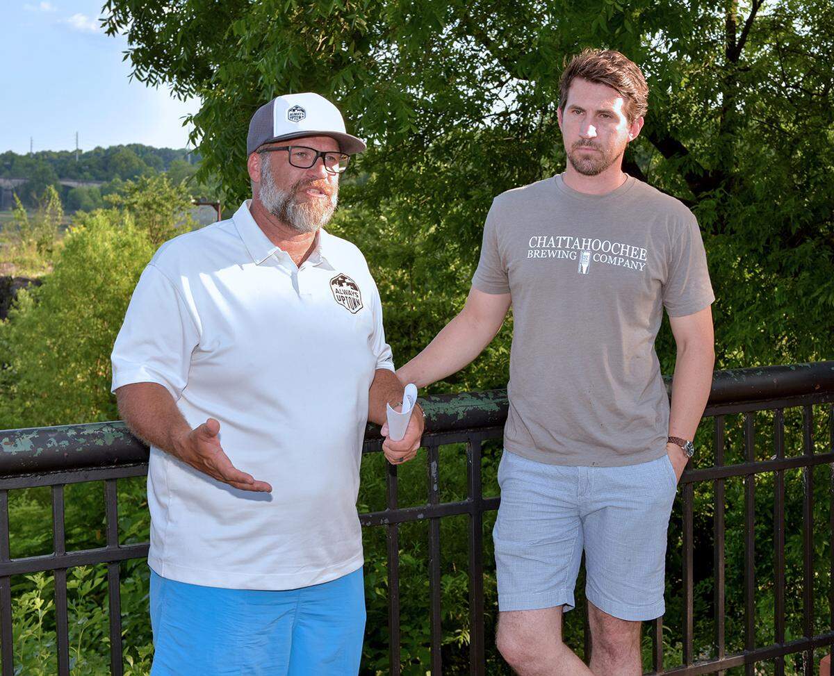 Ross Horner, president of Uptown Columbus and Shaun Culligan, Economic Development Manager at City of Phenix City stopping during a tour of the loop, running from the Pedestrian Street bridge to the Dillingham Street bridge show casing the various activities on both sides of the river to make an announcement of the rebranding of the Columbus, GA Whitewater Express and the Phenix City’s Whitewater Express, AL to Rush South Whitewater Park, Saturday May 25, 2019