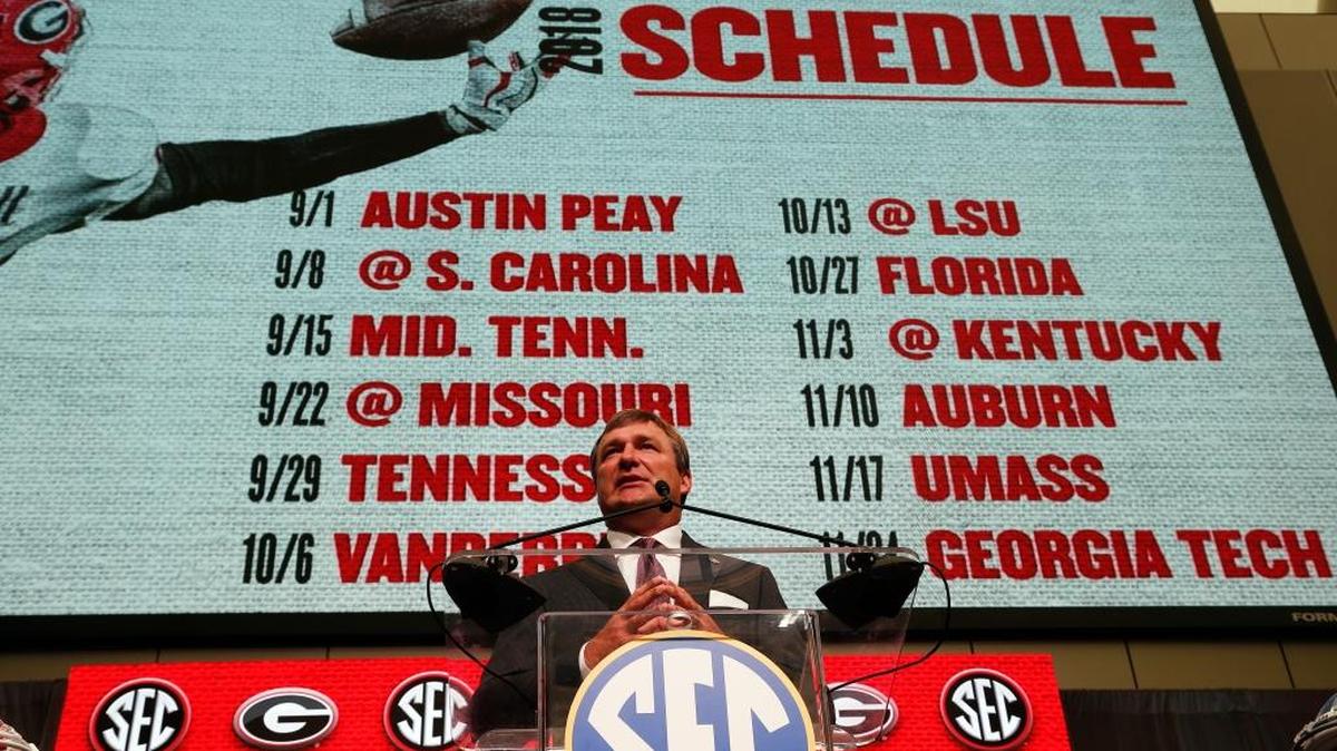 Georgia head coach Kirby Smart stands in front of the Bulldogs’ 2018 scheduled as he speaks during Southeastern Conference Media Days Tuesday, July 17, 2018, in Atlanta. (AP Photo/John Bazemore)