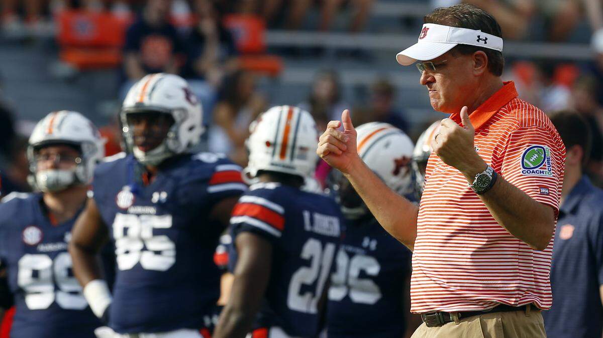 In this Saturday, Sept. 30, 2017, file photo, Auburn head coach Gus Malzahn walks around during warmups before an NCAA college football game against Mississippi State in Auburn, Ala.