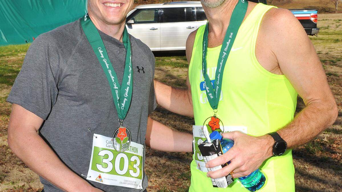 Connor Roche, who finished in second place with a time of 3 hours 2 minutes, and Dean Thompson, who finished first with a time of 2 hours 58 minutes, congratulate each other after completing the Callaway Gardens Marathon on Saturday.