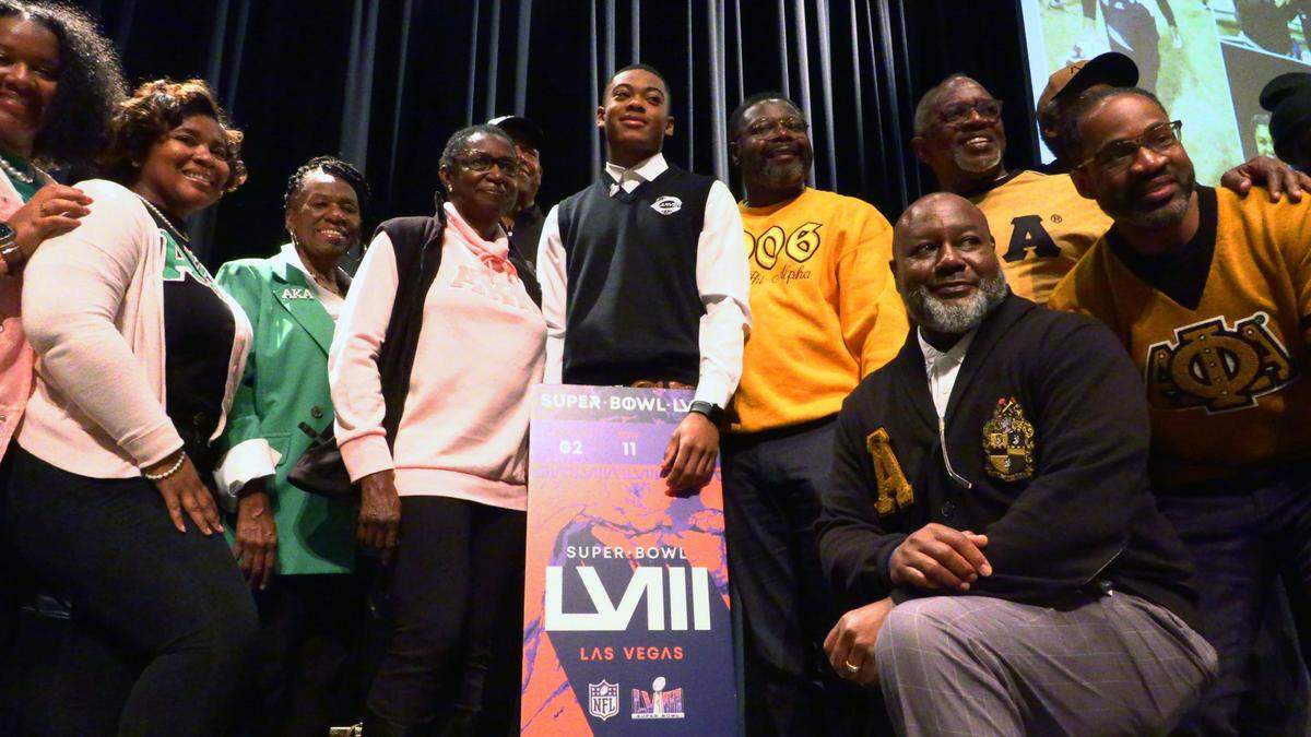 George Washington Carver High School junior Braylon Jakes, center, learned during Friday’s assembly that the NFL is providing two tickets for him and a guest to attend Super Bowl LVIII in Las Vegas. 11/03/2023
