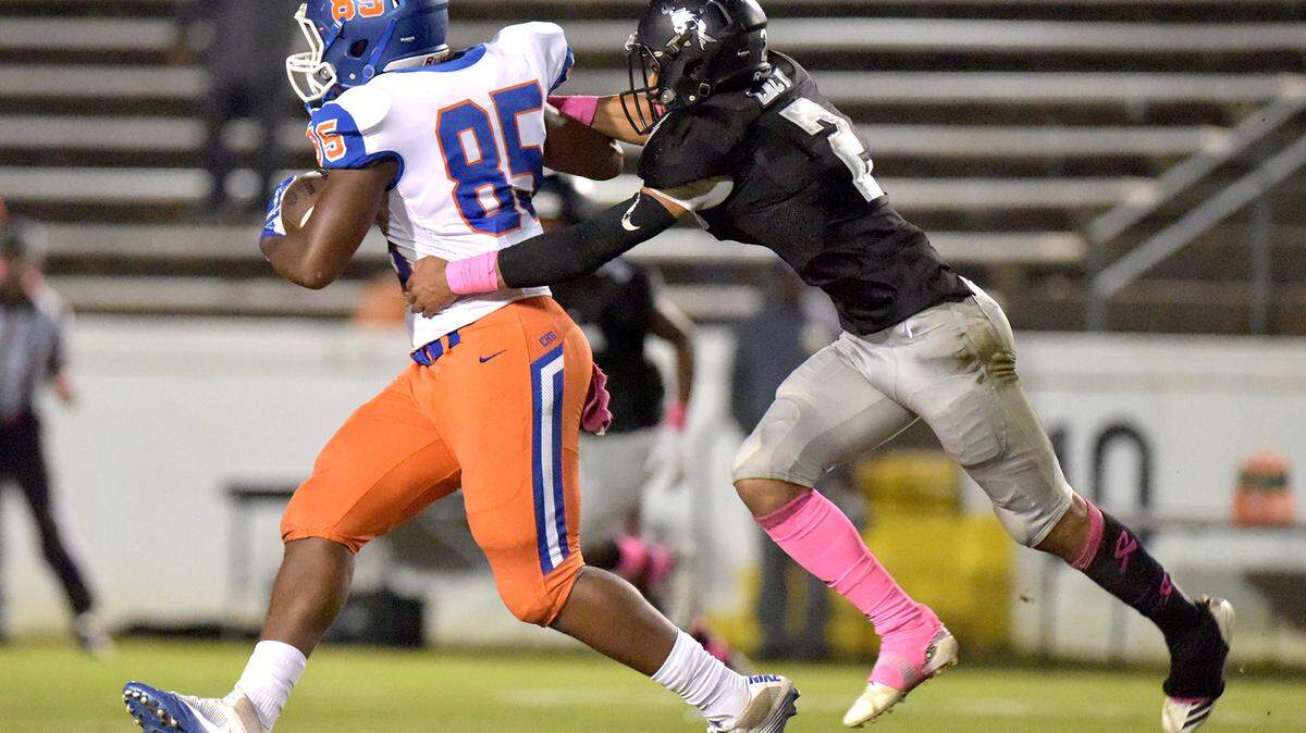 Columbus wide receiver Tajuan Wynn makes the catch against Shaw defensive back Andrew Lacy in the first quarter of Friday night’s game at A.J. McClung Memorial Stadium on October 12, 2018.
