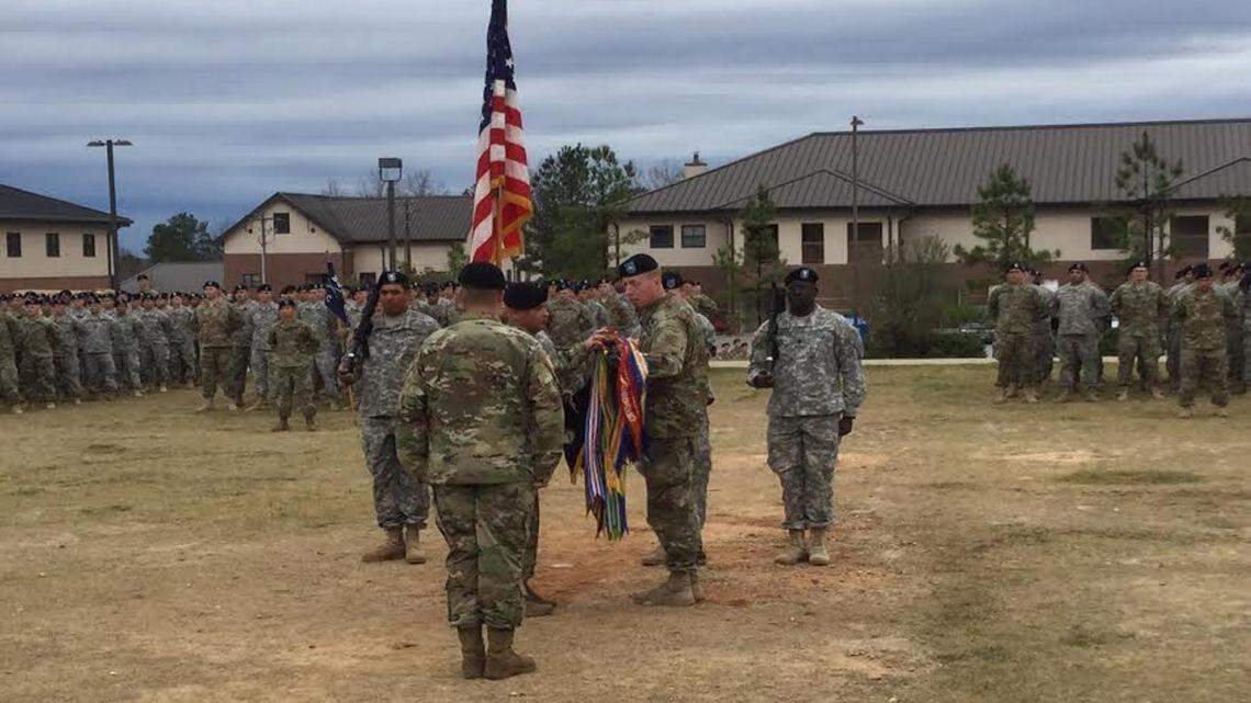 BEN WRIGHT/benw@ledger-enquirer.comLt. Col. Fred W. Tanner, at right, unfurls the Task Force 1-28 colors with Command Sgt. Maj. Raymond M. Mabrey during a ceremony Wednesday at Fort Benning.